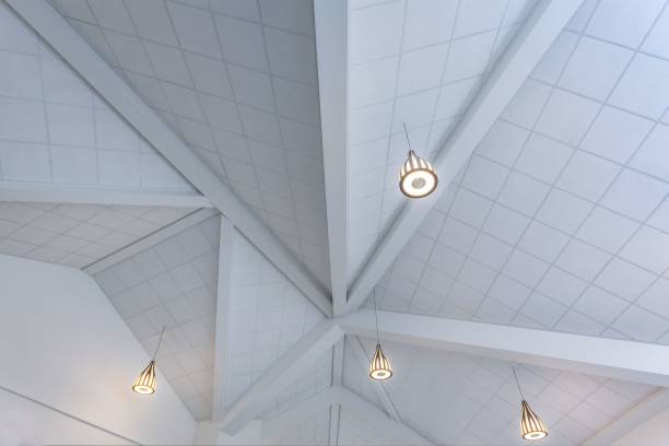 istock 3D rendering of pendant lamps hanging from a white ceiling for house interiors 1445365599