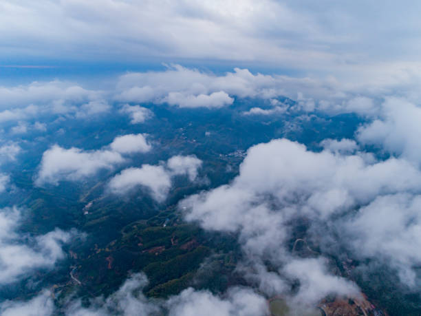 istock sea of clouds green forest overlooking 1445365702