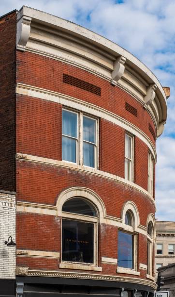 istock Vertical closeup of a curved old brick stone building facade 1445366202