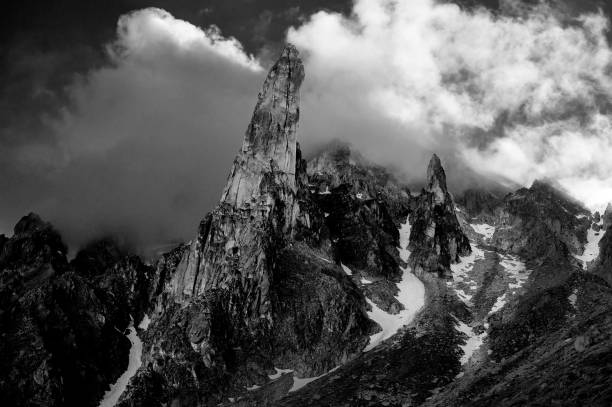 istock Grayscale of a mountain summit covered with clouds in Switzerland 1445366868