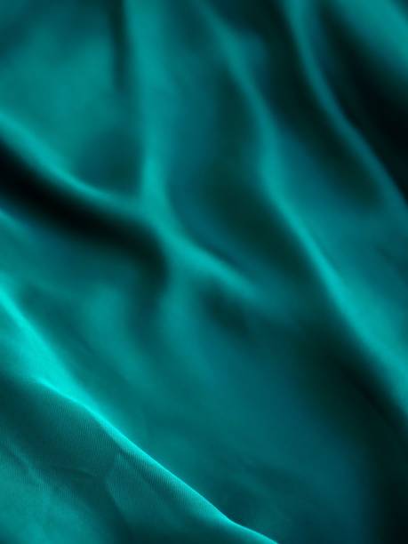 istock Vertical shot of shiny blue fabric surface background, copy space 1445367578