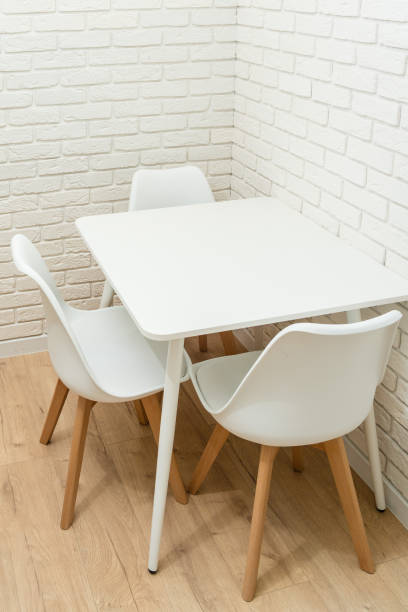 istock White brick wall with table in corner of kitchen 1445367849