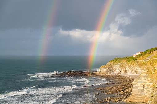 Saint-Jean-de-Luz in France, panorama of a rainbow, beautiful light at sunset