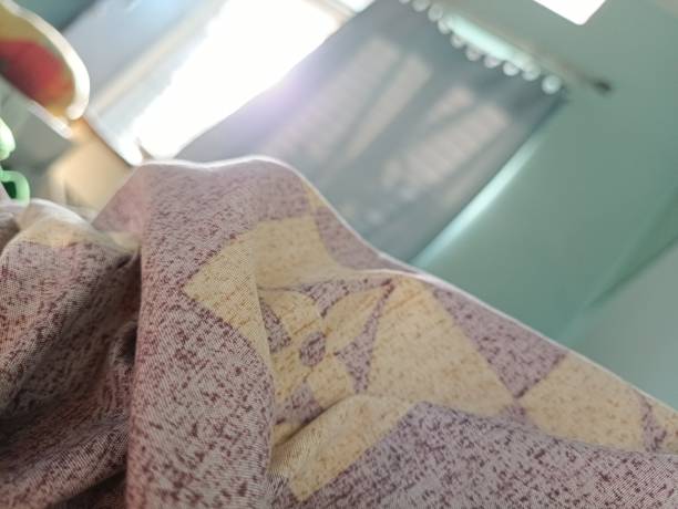 istock sunlight coming in through the door, with a messy bed atmosphere 1445368632