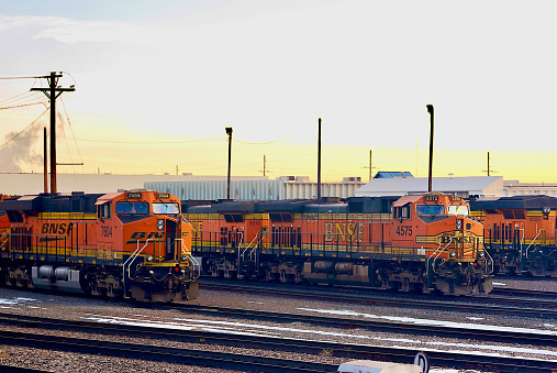Denver, Colorado, USA - January 5, 2016: Several BNSF locomotives lined up in the rail yard in downtown Denver on a cold winter morning.