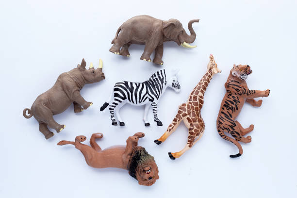 Plastic jungle animal toys on white background.