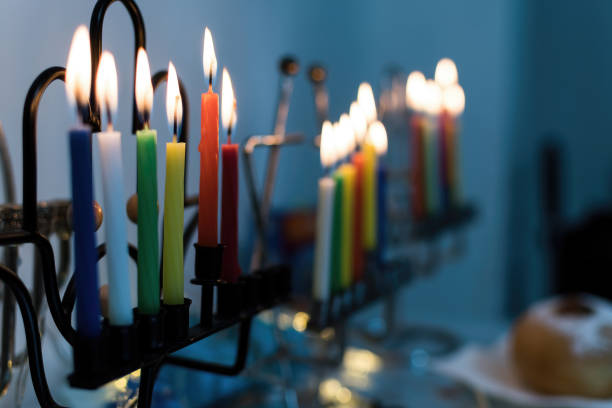 Low key image of jewish holiday Hanukkah background with menorah (traditional candelabra). Low key image of jewish holiday Hanukkah background with menorah (traditional candelabra). orthodox judaism photos stock pictures, royalty-free photos & images