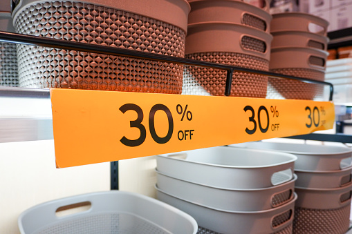 30 percent discount label for brown plastic basket items as the newest product. Photos of household appliances that are getting special discounts