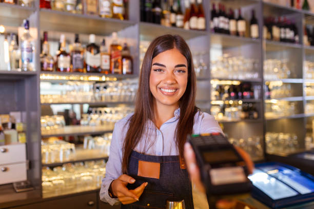 istock Contactless payment concept, female holding terminal nfc technology on counter, client make transaction pay bill on terminal rfid cashier machine in restaurant store, close up view 1445373078