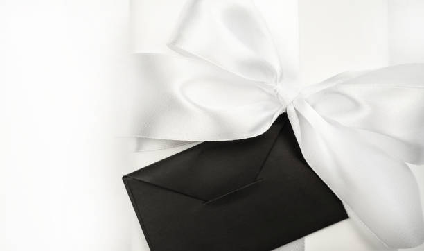 istock Gift white box with a bow and an envelope on a white background. Holiday concept.Holiday concept, gift. 1445373488