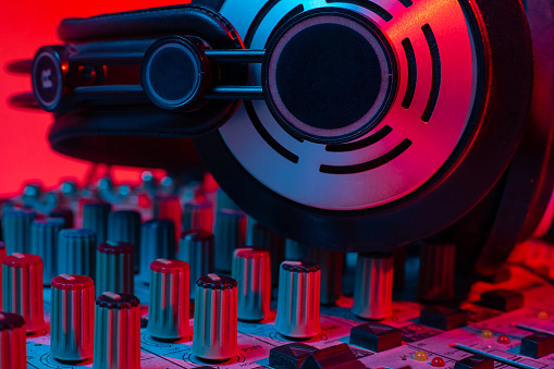 sound mixer and headphones. club party DJ sound engeneering