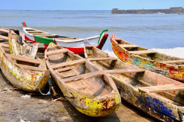 istock Fishing Boats Moored On Beach Against Sky 1445375820