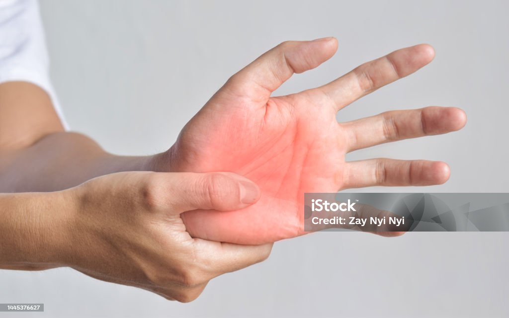Painful palm of Asian man. Concept of compartment syndrome, cellulitis and hand muscles pain. Painful palmar aspect of Asian young man. Concept of compartment syndrome, cellulitis and hand muscles pain. Adult Stock Photo