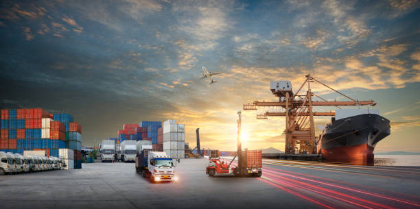 istock forklift handling container box loading to truck in import export logistic, Business logistics concept 1445378737