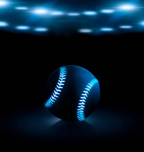 istock 3D rendering of single black baseball ball with bright blue glowing neon lines on a black background under stadium lights 1445378778