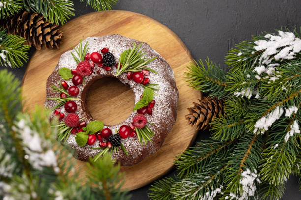 istock Christmas cake with pomegranate seeds, cranberries and rosemary 1445378954