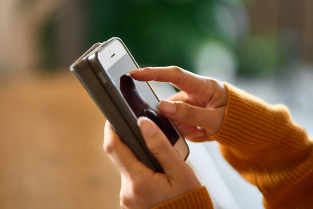 A woman posting on SNS with a smartphone