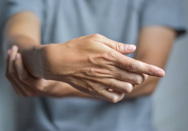 istock Fingers rigidity, Hand muscles spasm, or Weakness of digits. 1445380662