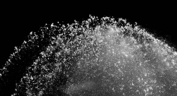 Abstract forms of splashing water on black background as overlay