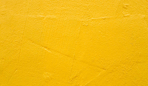 pared en blanco áspera pintada con pintura amarilla brillante como fondo de textura o telón de fondo - space artist nobody art fotografías e imágenes de stock