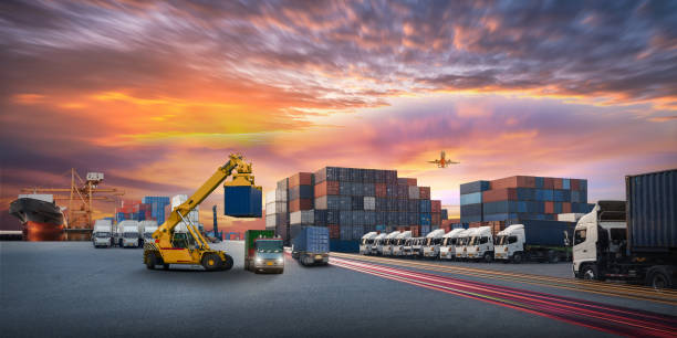Logistics and transportation of Container Cargo ship and Cargo plane with working crane bridge in shipyard at sunrise, logistic import export and transport industry background