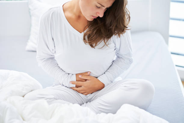istock Young brunet woman sick in the bed 1445386411