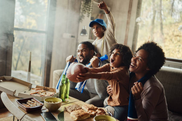 istock Cheering for favorite rugby team at home! 1445387306