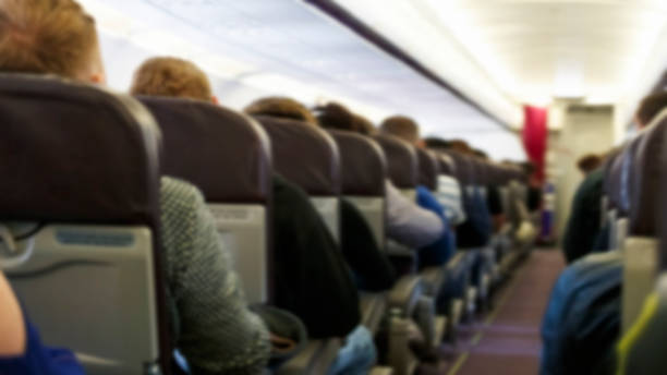 istock Blur background of passenger plane cabin 1445389409