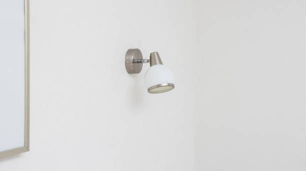 istock Modern LED wall lamp, close-up. White lamp for lighting. 1445391738