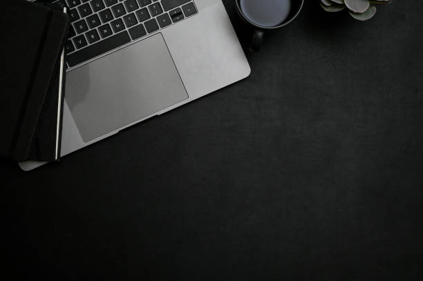 istock Modern black office desk top view, flat lay with laptop, accessories and copy space. workspace 1445391802