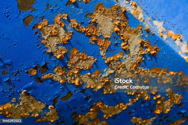 Rust Oxidation Paint Flaking Whimsical Sky Blue Yellow Brown Shipping Ship Exterior Pleasure Boating Maintain Scrape Off Derust Winter Abrade Chip Off Fresh Water Enemy Oxygen Corrosion Affect Iron Oxide Connection Chemical Chemi Stock Photo - Download Image Now