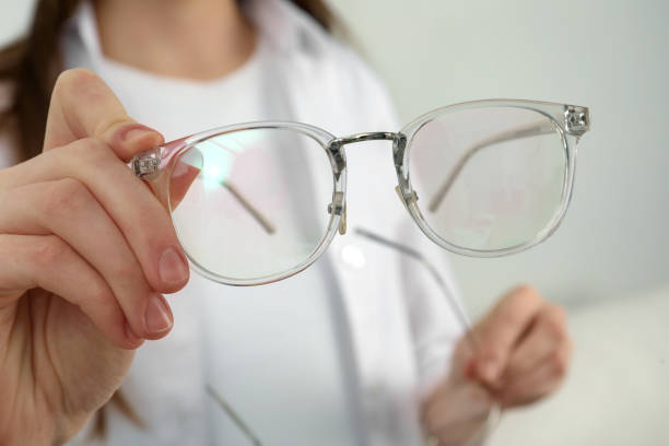 istock Woman with glasses on light background, closeup 1445392983