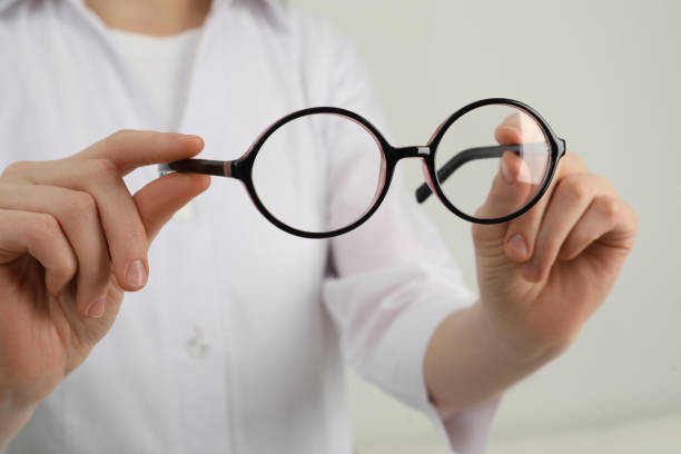 istock Woman with glasses on light background, closeup 1445393036