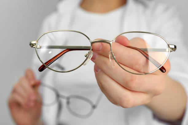istock Woman with glasses on light background, closeup 1445393315
