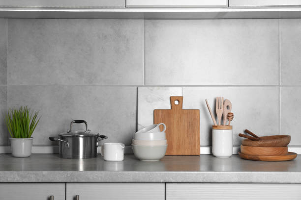 istock Cooking utensils and other kitchenware on grey countertop 1445393411