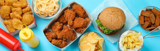 istock Concept of fast food on blue background 1445394479