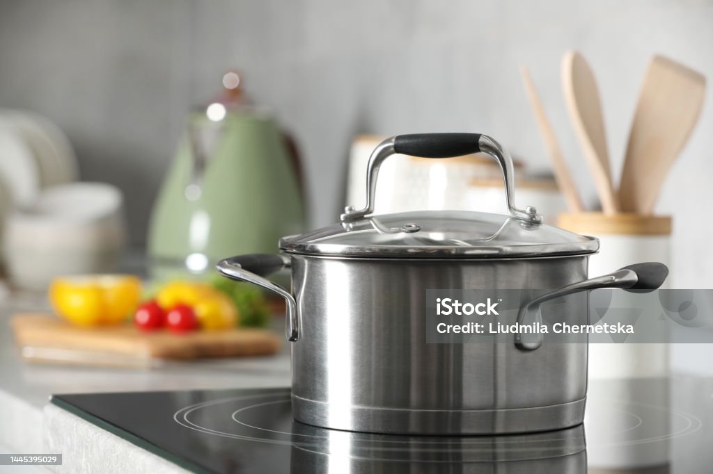 New shiny pot with glass lid in kitchen Cooking Pan Stock Photo