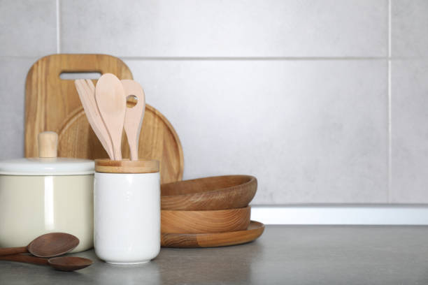 istock Cooking utensils and other kitchenware on grey countertop. Space for text 1445395033