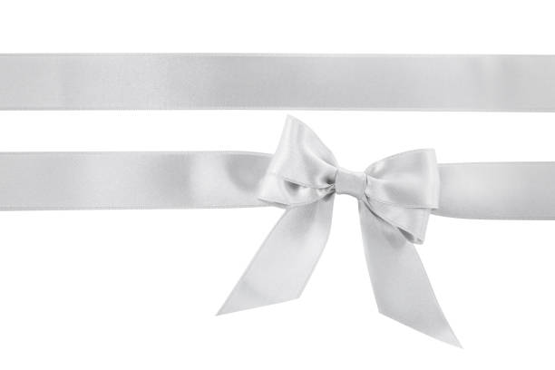 istock Silver satin ribbons with bow on white background, top view 1445395072
