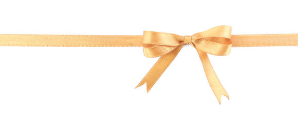istock Golden satin ribbon with bow on white background, top view 1445395801