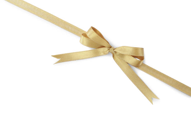 istock Golden satin ribbon with bow on white background, top view 1445395840