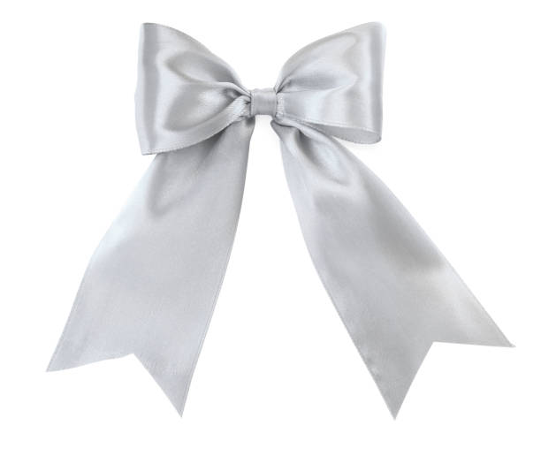 istock Beautiful silver ribbon tied in bow isolated on white, top view 1445395909
