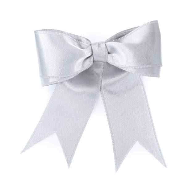 istock Beautiful silver ribbon tied in bow isolated on white, top view 1445395945