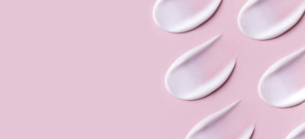 istock cosmetic smears cream texture on pink background 1445396003