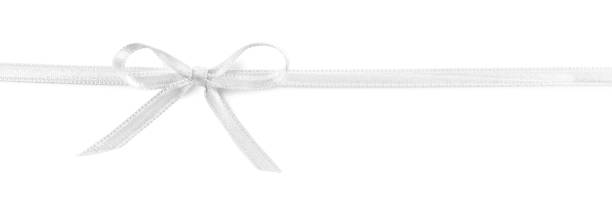 istock Satin ribbon with bow on white background, top view 1445396125