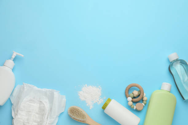 istock Flat lay composition with dusting powder and other baby care products on light blue background, space for text 1445397220