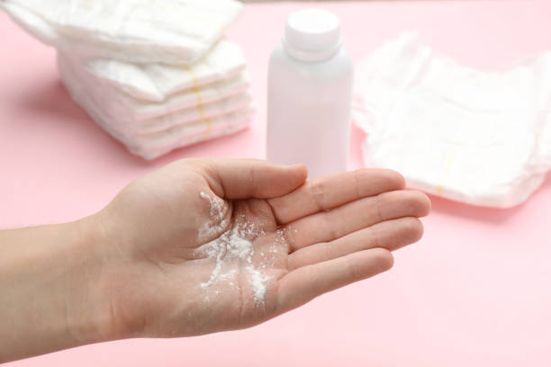 istock Woman with dusting powder on pink background, closeup 1445397221