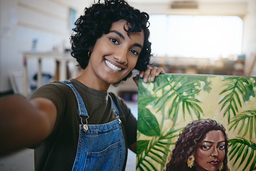 Selfie, painting and art work of a woman student from India happy about her artist portrait. Creative painter person with a smile done with a creativity paint canvas and drawing design in a studio