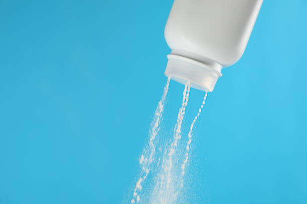 istock Scattering of dusting powder on light blue background, space for text 1445399204