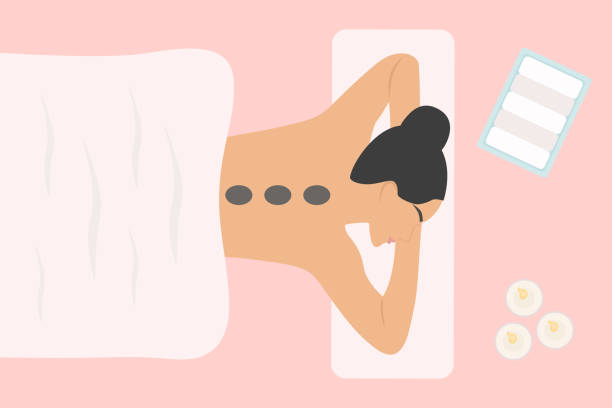 ilustrações de stock, clip art, desenhos animados e ícones de top view of young woman having hot stone massage on spa bed. relaxation and spa concept - indulgence